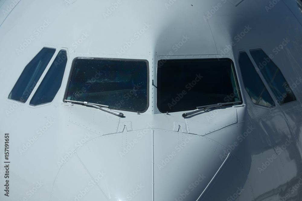 Close-up view of airplane nose in airport