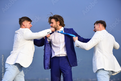 business people fighting on blue sky background, conflict