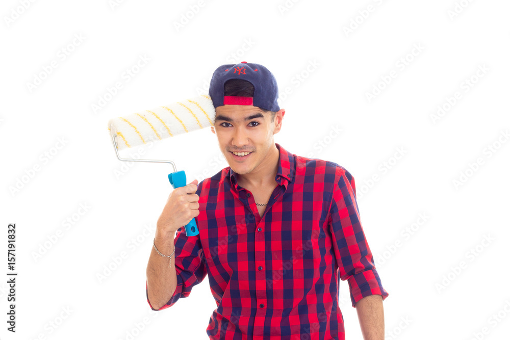 Young man in snapback holding roll