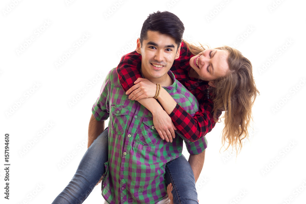 Young couple in plaid shirts