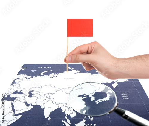 World map with magnifying g...
