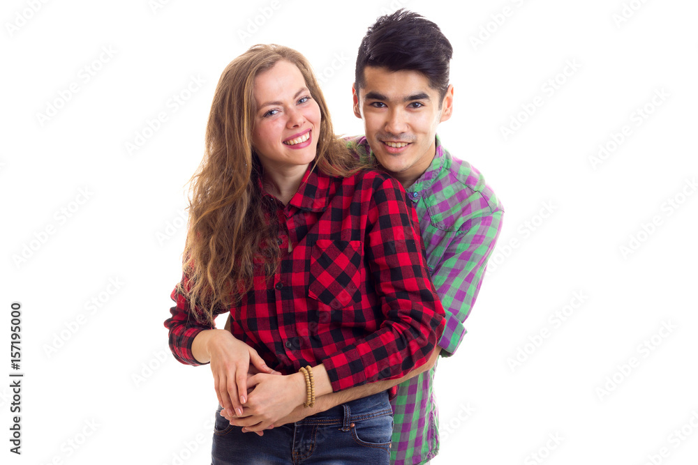 Young couple in plaid shirts Young couple in plaid shirts