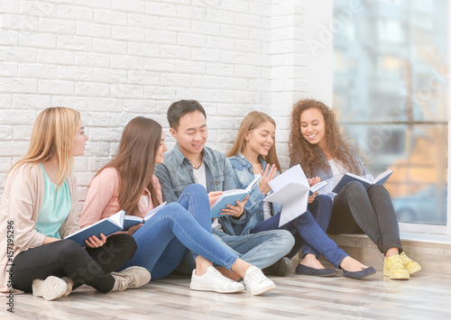 Group of people reading boo...
