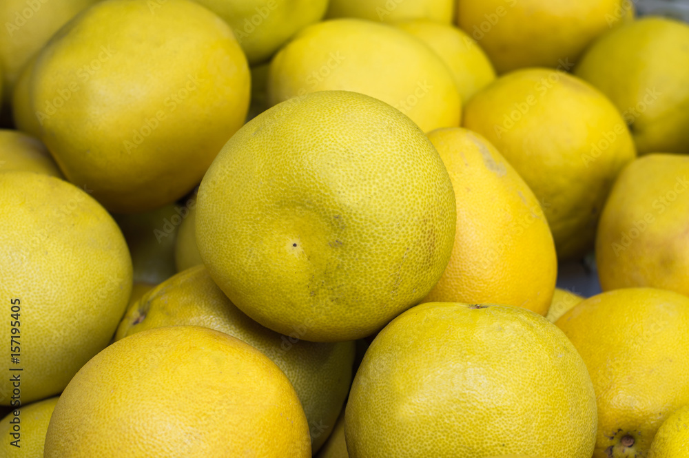 Ripe grapefruit, yellow, sale at vegetable market. Backdrop. Top view. Close-up