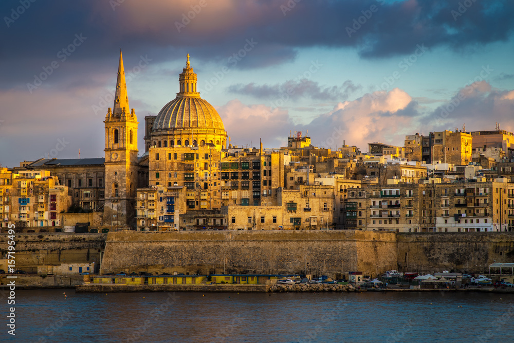 Valletta, Malta - Golden hour at the famous St.Paul's Cathedral and the city of Valletta