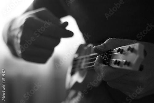 Playing ukulele guitar © Alexander
