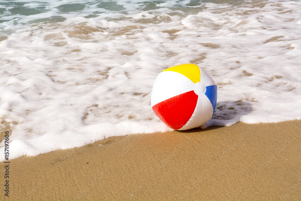 Beach ball on sand