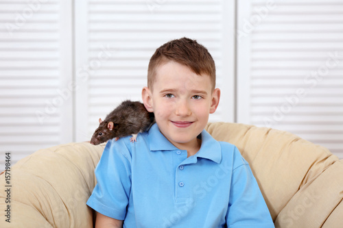 Cute boy with funny rat at ...