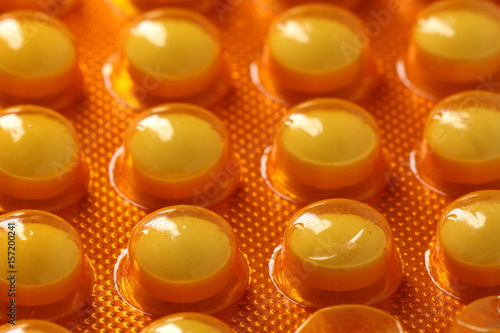 Orange medicine pills in blister pack