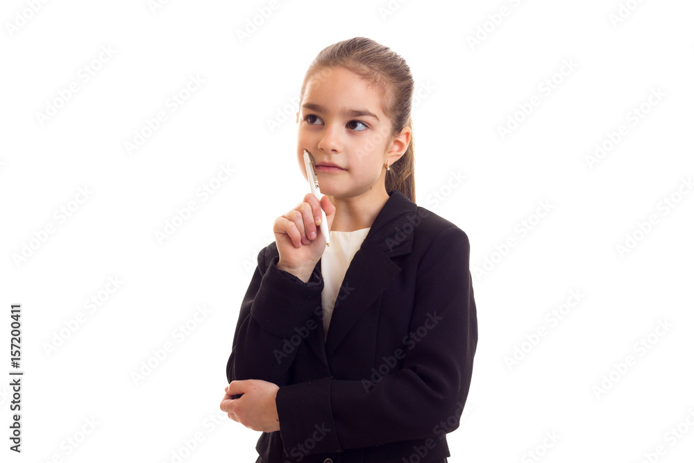Little girl in black jacket holding pen Little girl in black jacket holding pen