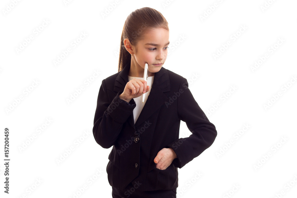 Little girl in black jacket holding pen Little girl in black jacket holding pen