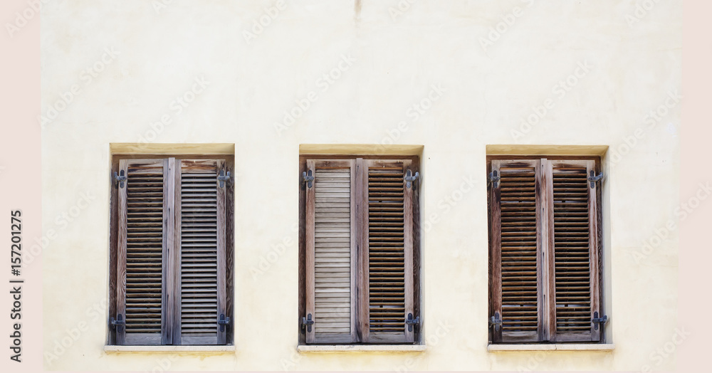 Fototapeta premium Vintage windows with brown rustic wooden shutters