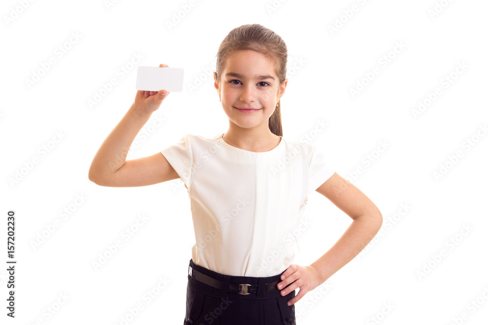 Little girl in white T-shirt holding white card