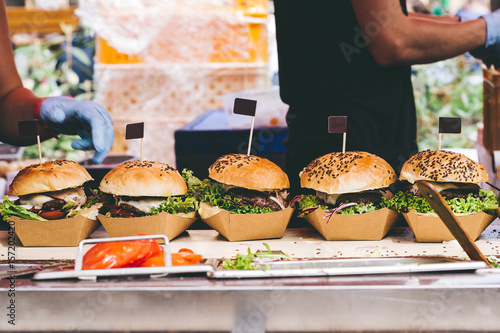 Fresh delicious grilled burgers on the table. Burger festival