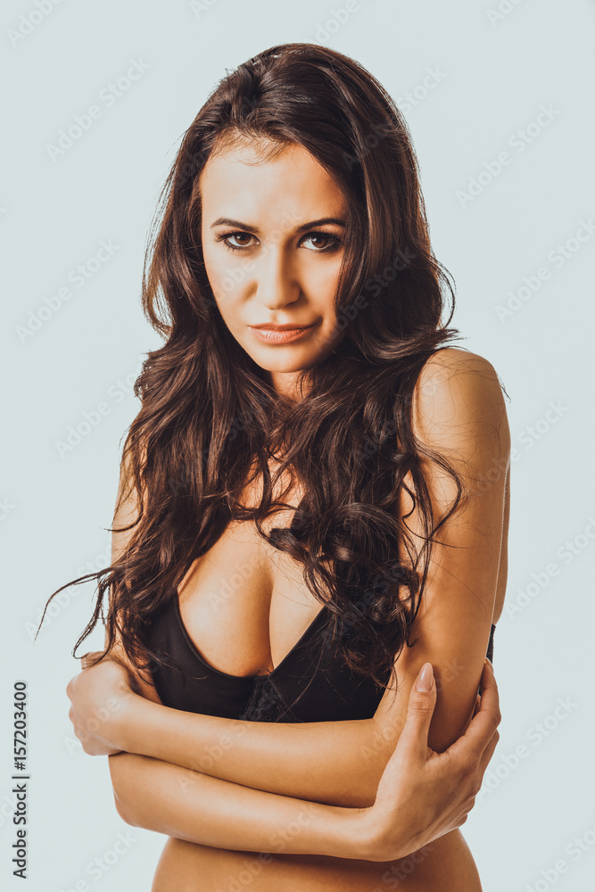 Portrait of a woman in lingerie with folded arms Portrait of a woman in lingerie with folded arms