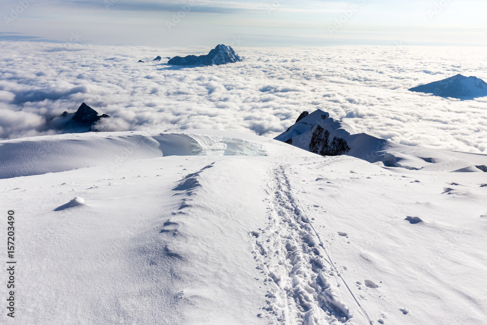 Sunrise above mountains peaks clouds Huayna Potosi , Bolivia mountaineering tourism.