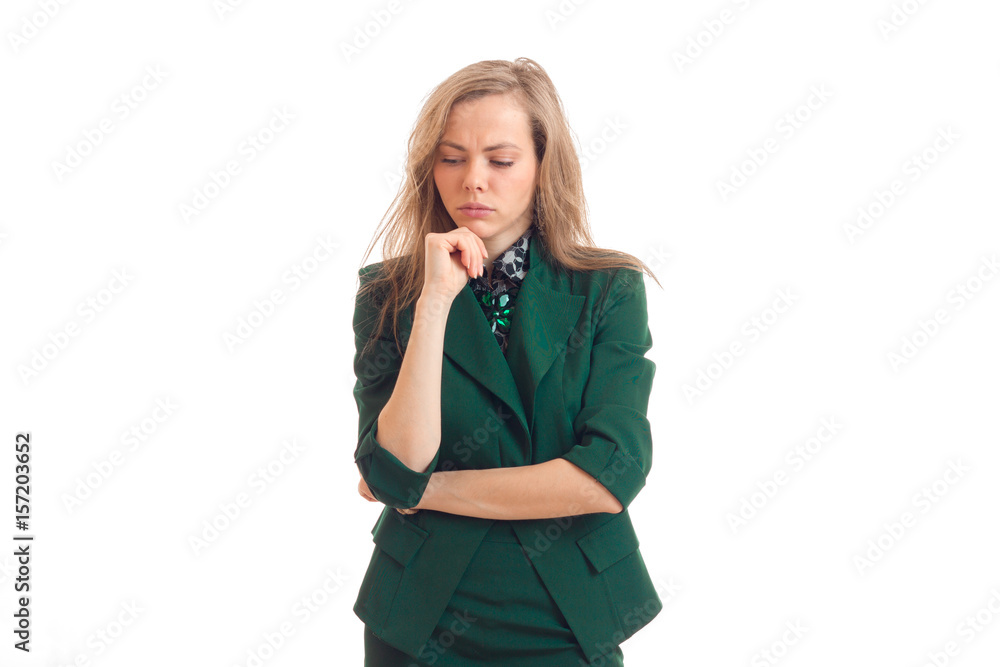 beautiful young blonde stands in a green costume holds the arm near the face and lowered her eyes down beautiful young blonde stands in a green costume holds the arm near the face and lowered her eyes down