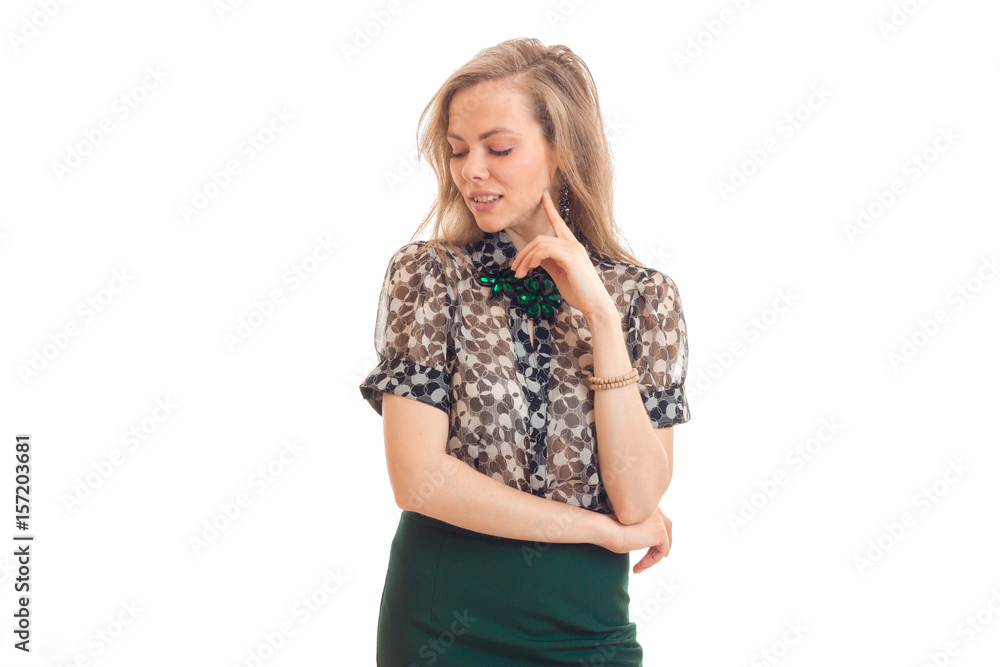 a charming young girl with blond hair keeps the arm near the face and lowered her eyes down a charming young girl with blond hair keeps the arm near the face and lowered her eyes down