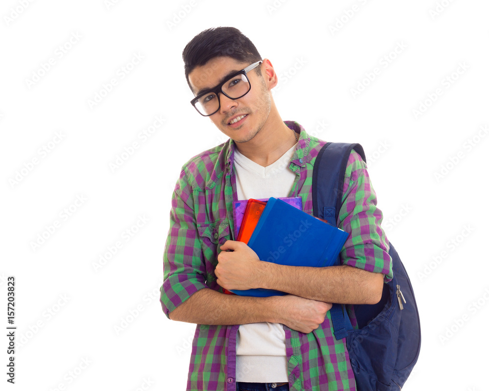 Young man with backpack and books Young man with backpack and books