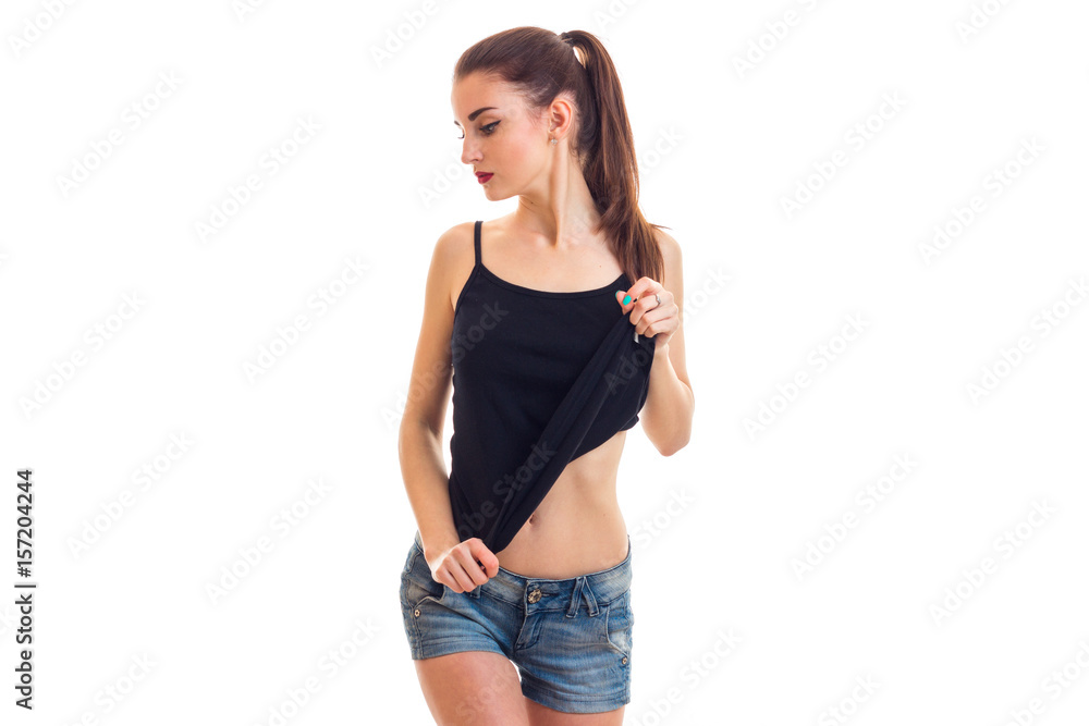young skinny teen cutie alienated his head to the side and picks up shirt  hands Stock Photo | Adobe Stock