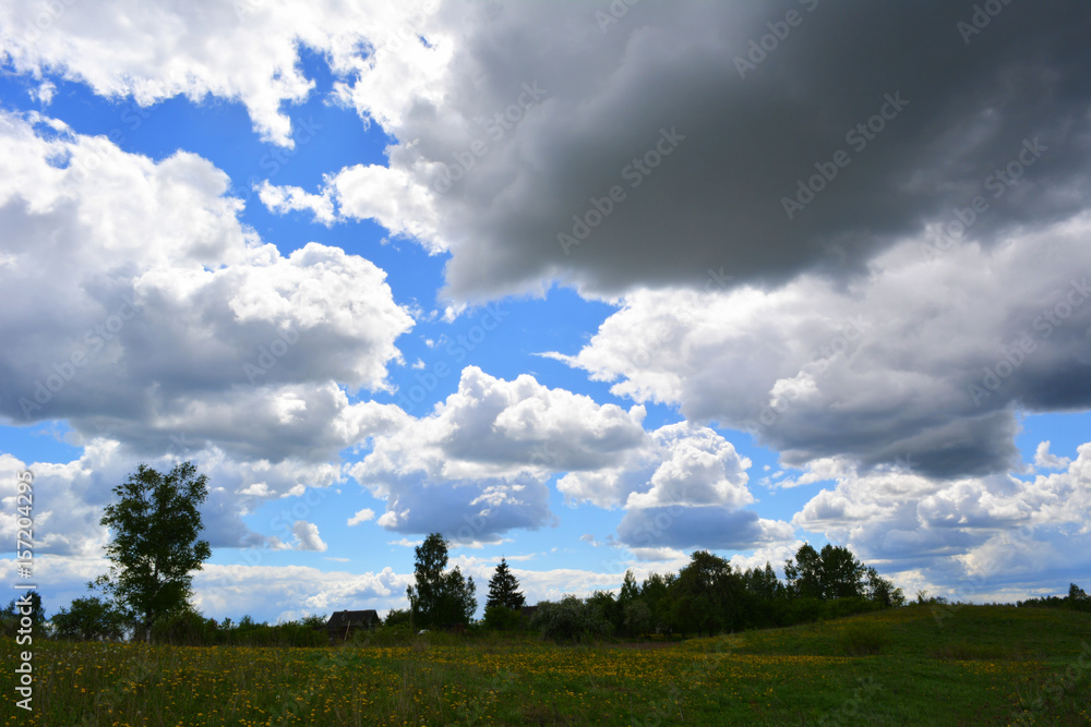 Big dark clouds over the field, countryside, nature, before the rain Big dark clouds over the field, countryside, nature, before the rain