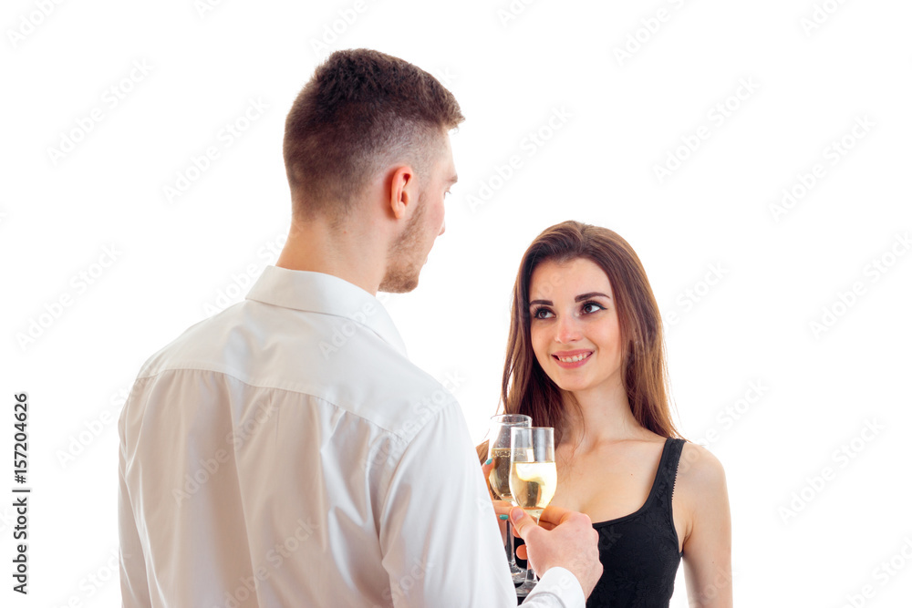 the young man turned to a beautiful girl and drinking wine with her close-up the young man turned to a beautiful girl and drinking wine with her close-up