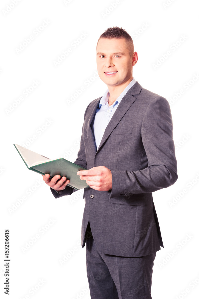 Young businessman reading his note book