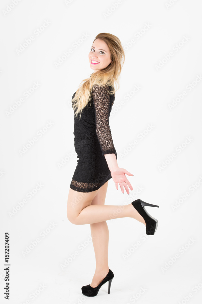 Tall blonde gorgoeus girl with high heels and lace black dress standing full body shot Stock Foto Adobe Stock