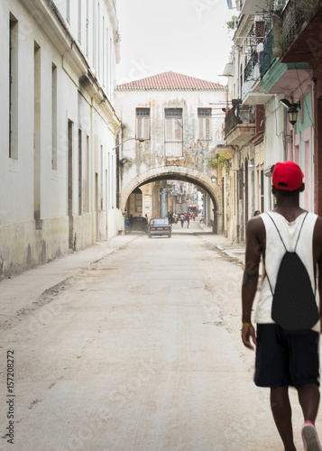 Man walking down street in Havana (La Habana), Cuba © Michelle Mealing Art