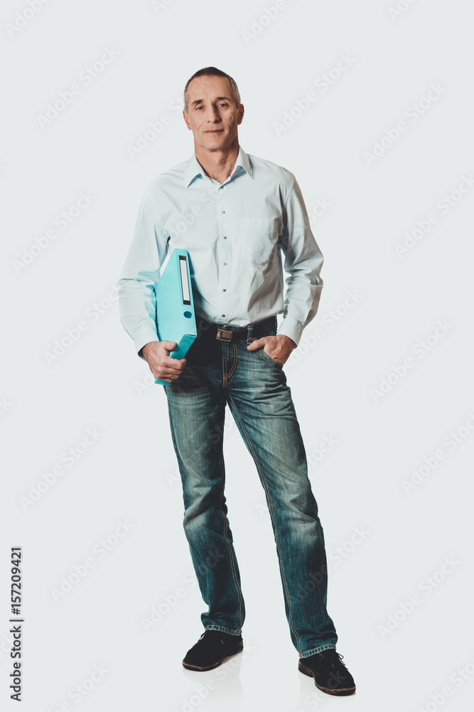 Handsome man holding blue binder Handsome man holding blue binder