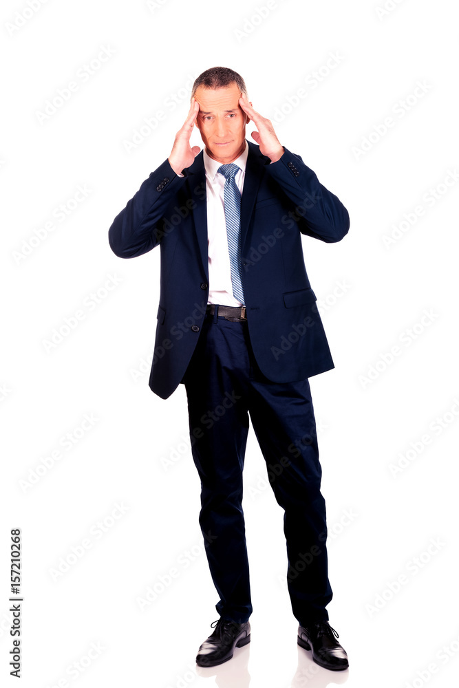 Full length businessman suffering from headache Full length businessman suffering from headache