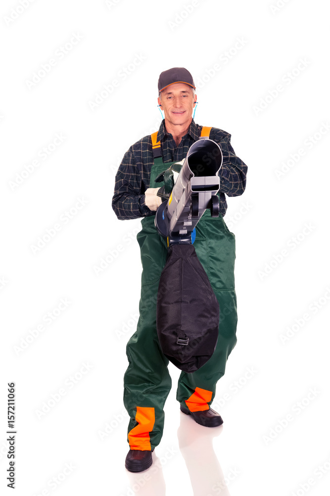Worker in uniform with a leaf blower Worker in uniform with a leaf blower
