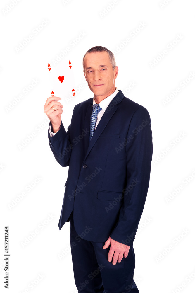 Elegant businessman with red ace card Elegant businessman with red ace card