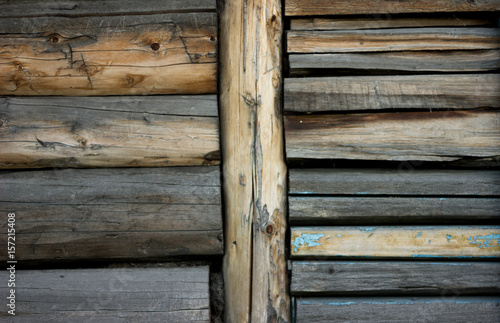 gray brown old log wall, background with wood texture