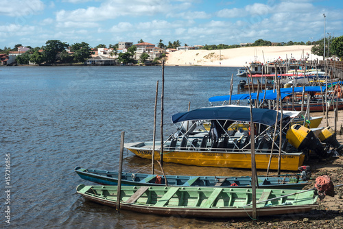 Tourist boats waiting for tourists on the river Rio Preguica, Barreirinhas, Lencois Maranhenses National Park, northern Brazil photo