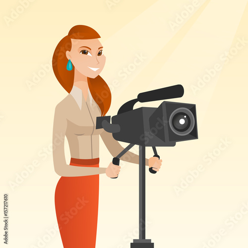 Cameraman with movie camera on tripod.