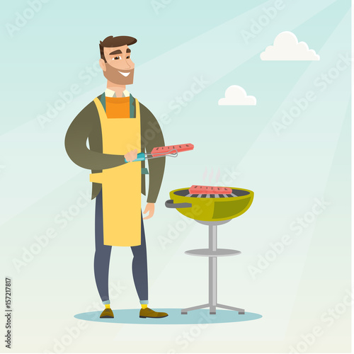 Man cooking steak on barbecue grill.