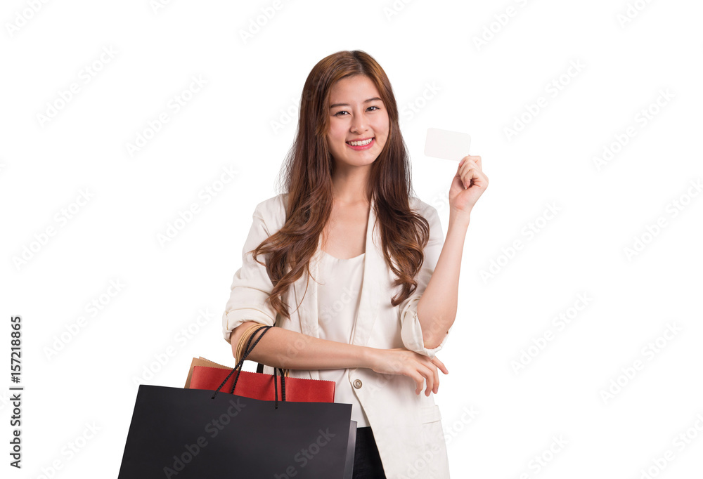 Woman holding shopping bag and credit card
