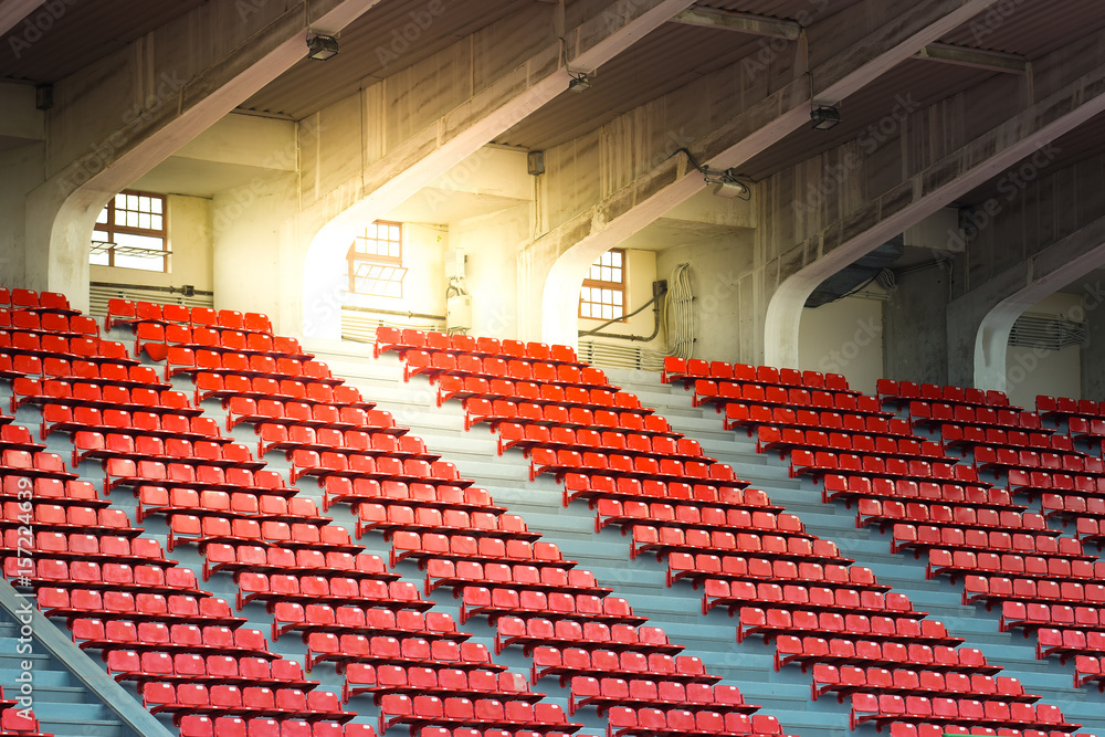 Naklejka premium Red chairs in stadium