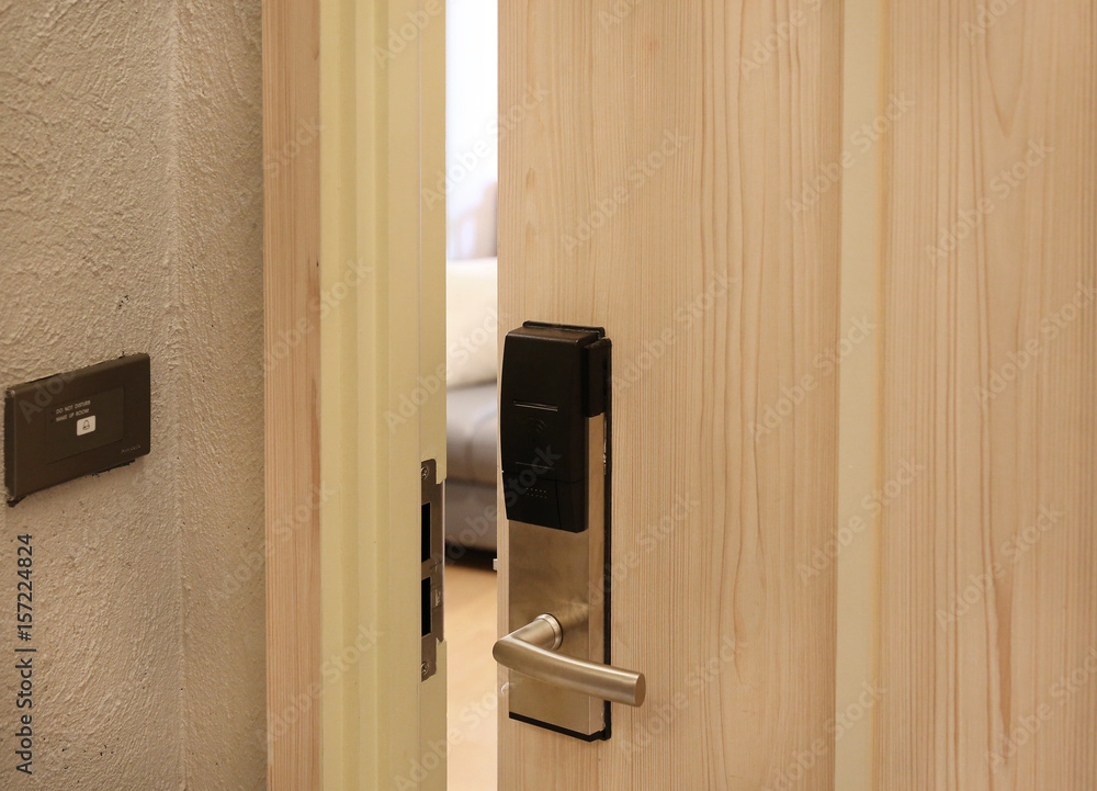 Obraz premium Half open door of hotel room.