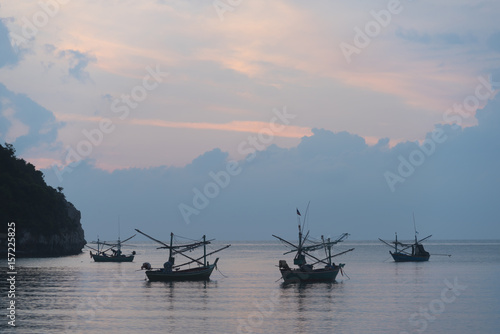 Wooden boat in Ubein Bridge at sunrise, Mandalay, Myanmar (World longest wooden bridge) photo