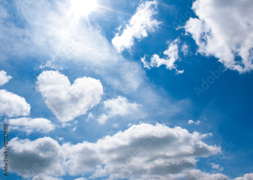 heart shape cloud in blue sky background with space for text