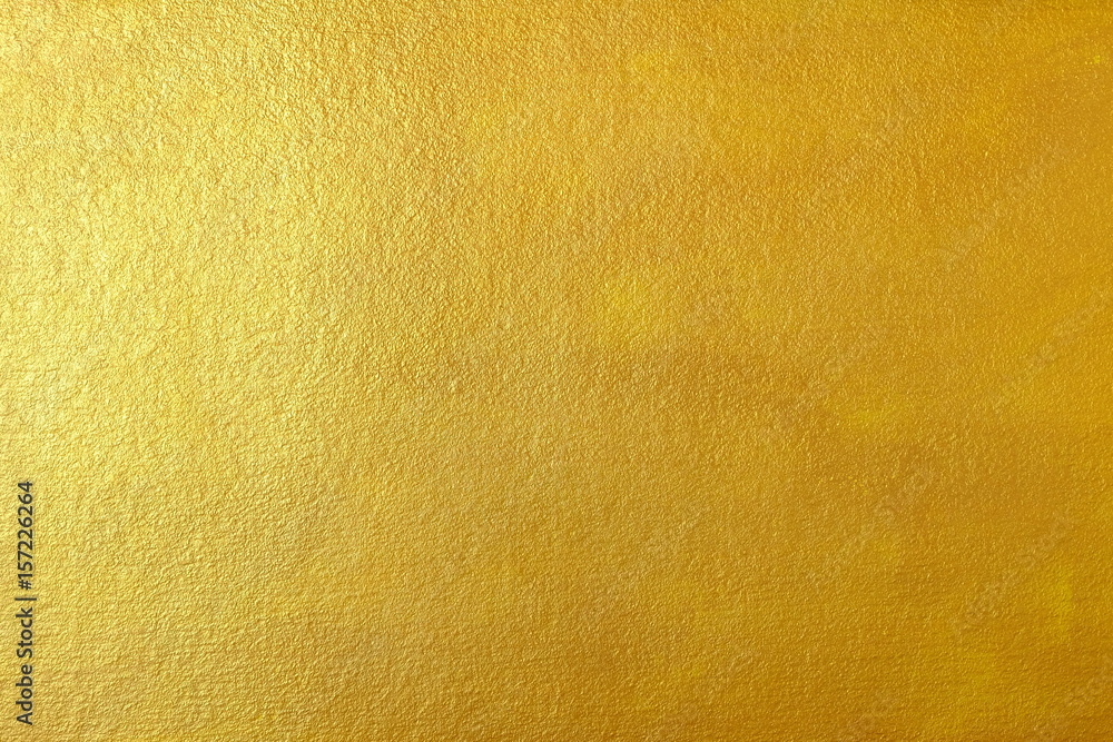 Obraz premium Gold Paint on Concrete Wall Texture Background.