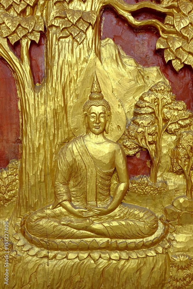 Ancient Sculptured Wood of Gold Buddha Image on Temple Door.