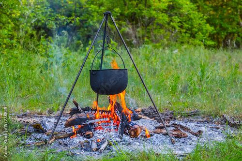 touristic cauldron in a camp fire