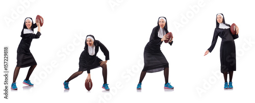 Pretty nun with rugby ball isolated on white