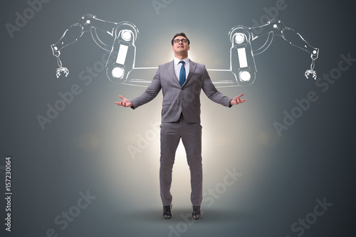 Fotografie Businessman man with robotic arms