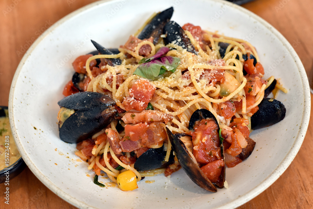 Seafood pasta in arabiata sauce, Spaghetti with clams and spicy tomato sauce. Seafood pasta in arabiata sauce, Spaghetti with clams and spicy tomato sauce.