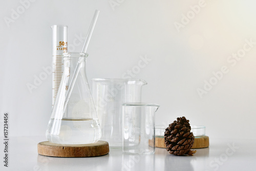 Group of laboratory glassware with natural ingredient for beauty products.