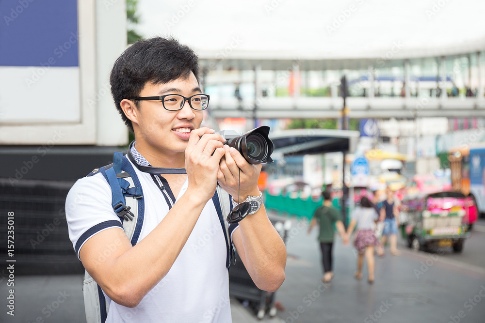 young asian travel with backpack and camera travel in Bangkok ci young asian travel with backpack and camera travel in Bangkok ci